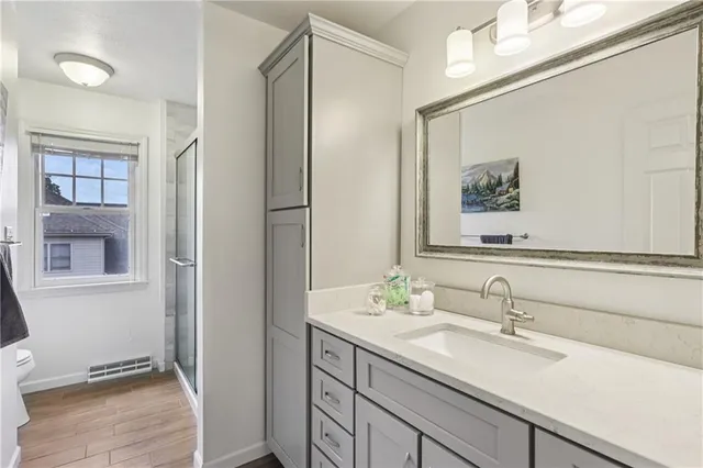 a picture of a bench in front of a gate