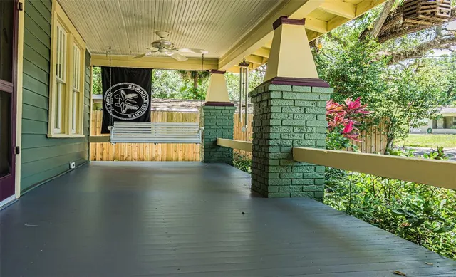 a view of a porch with wooden floor
