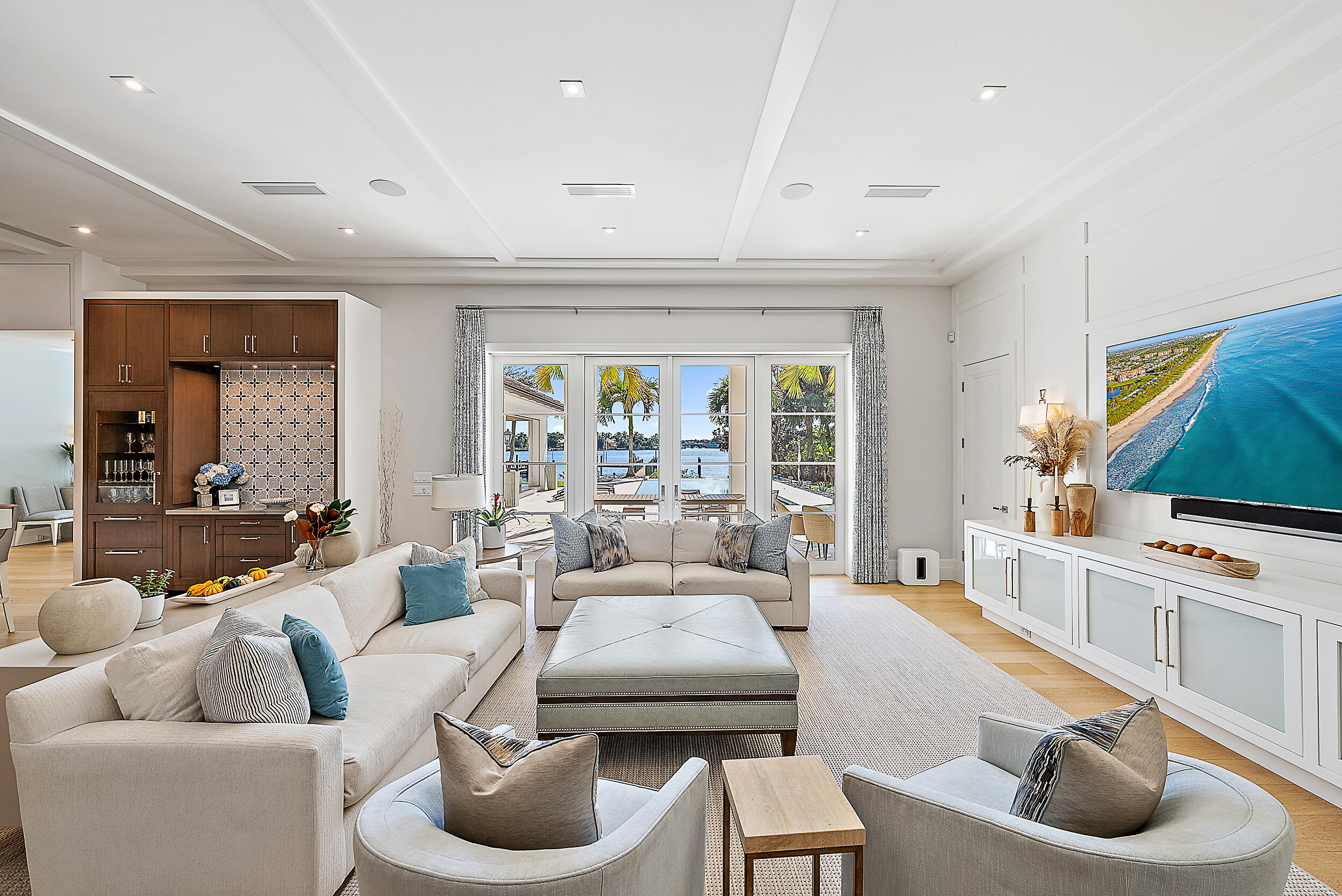 19651 North Riverside Drive Jupiter, FL 33469 - Photo 11 of 37 a living room with furniture and a flat screen tv