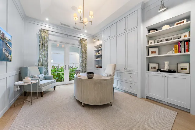 a living room with furniture window and a flat screen tv