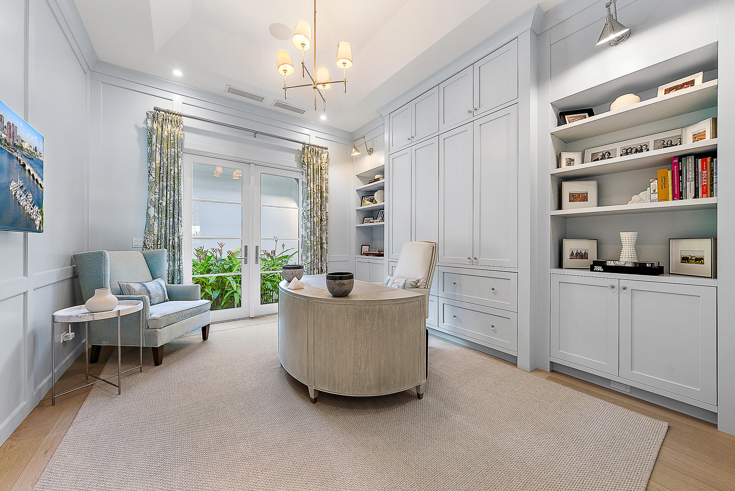 19651 North Riverside Drive Jupiter, FL 33469 - Photo 13 of 37 a living room with furniture and a chandelier