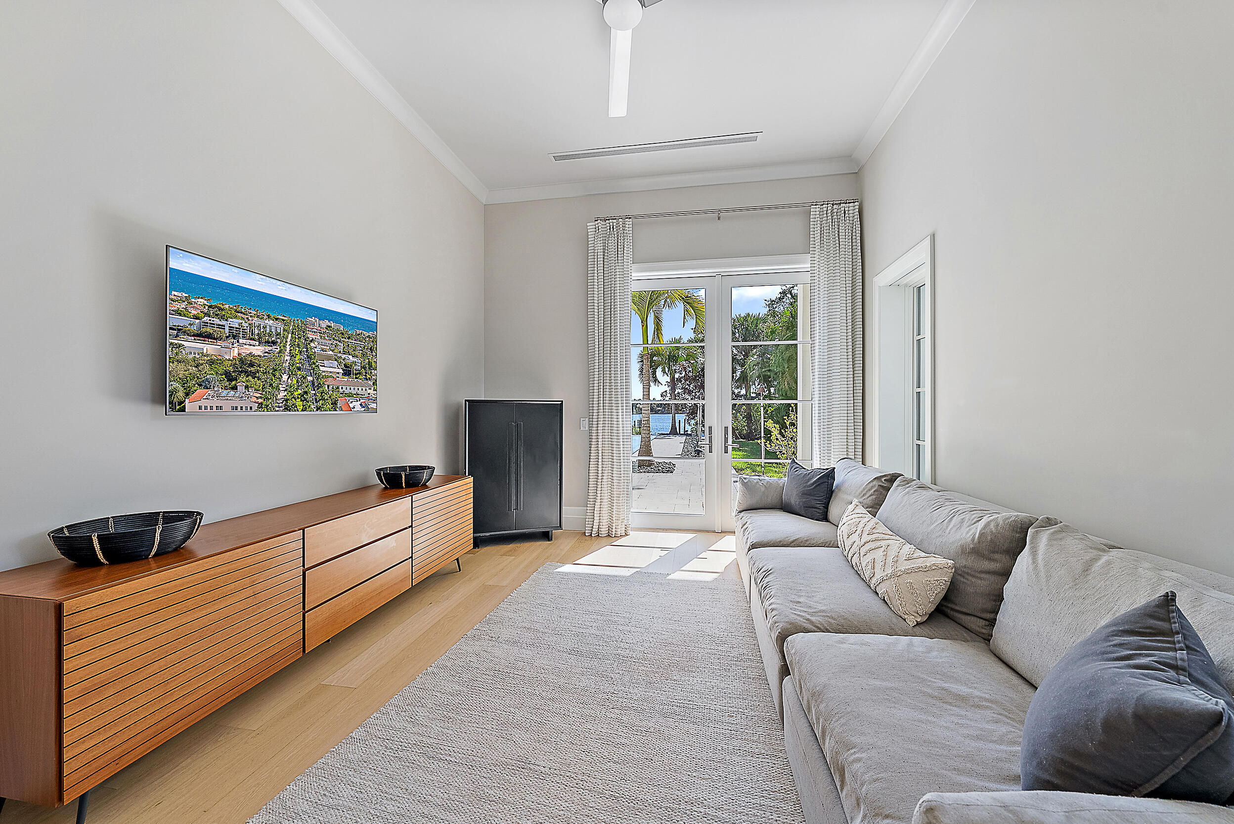 19651 North Riverside Drive Jupiter, FL 33469 - Photo 14 of 37 a living room with furniture window and a flat screen tv
