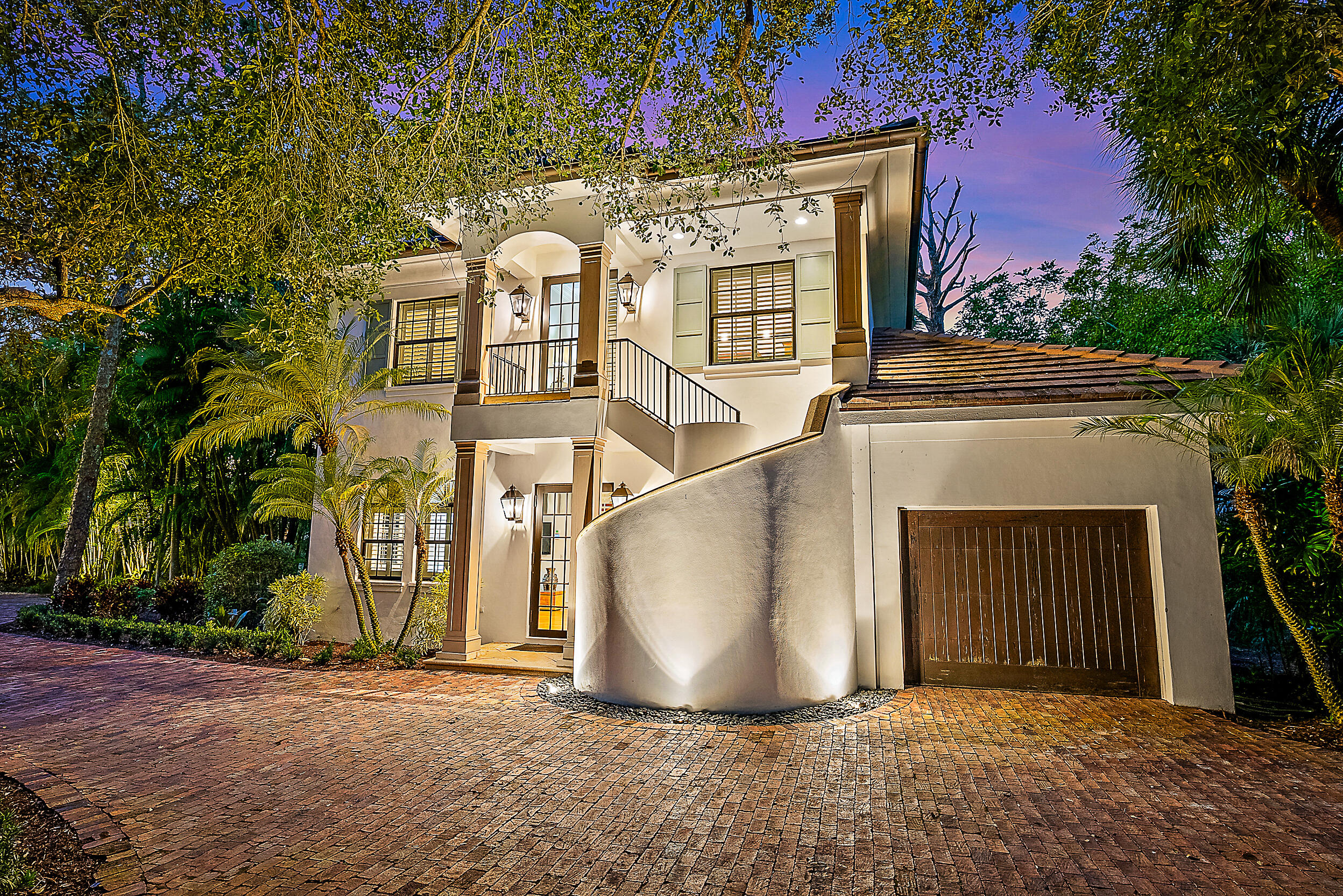 19651 North Riverside Drive Jupiter, FL 33469 - Photo 25 of 37 a front view of a house with a yard
