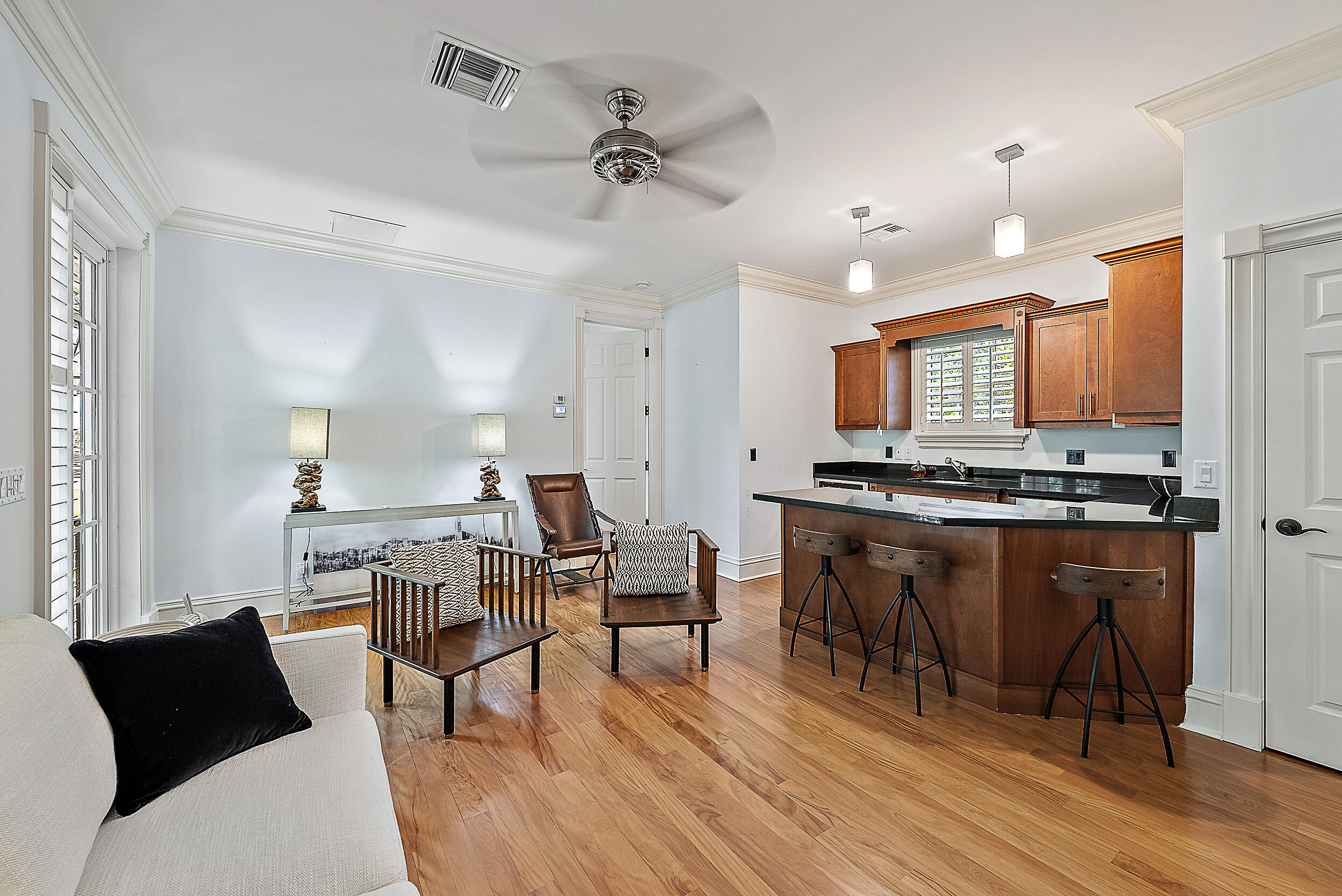 19651 North Riverside Drive Jupiter, FL 33469 - Photo 30 of 37 a view of kitchen with cabinets and wooden floor