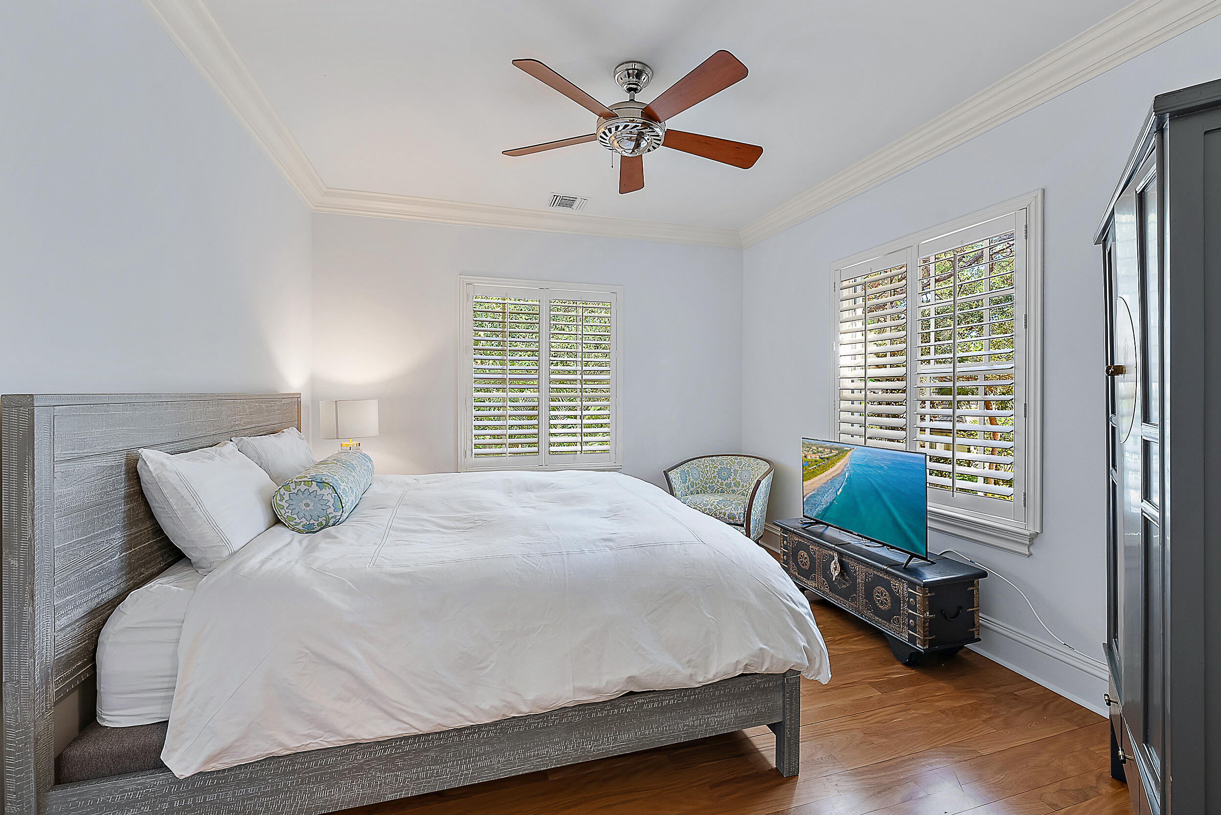 19651 North Riverside Drive Jupiter, FL 33469 - Photo 31 of 37 a bedroom with a bed and window