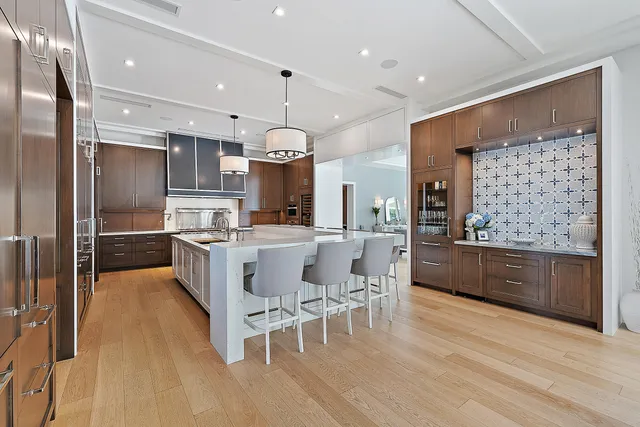 a kitchen with granite countertop a stove and cabinets