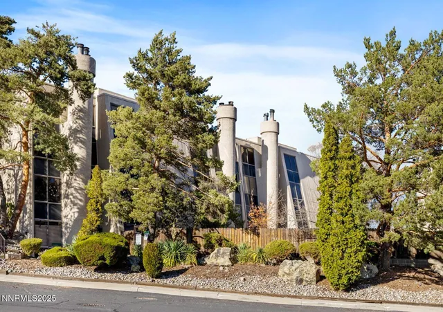 front view of a house with a tree