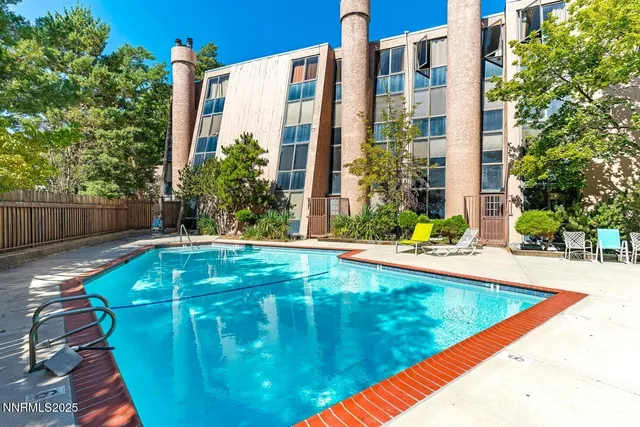 a view of swimming pool with outdoor seating