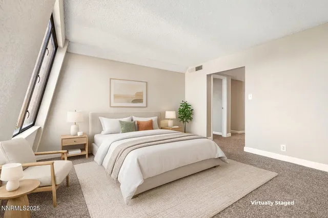 a bedroom with a bed and a mirror