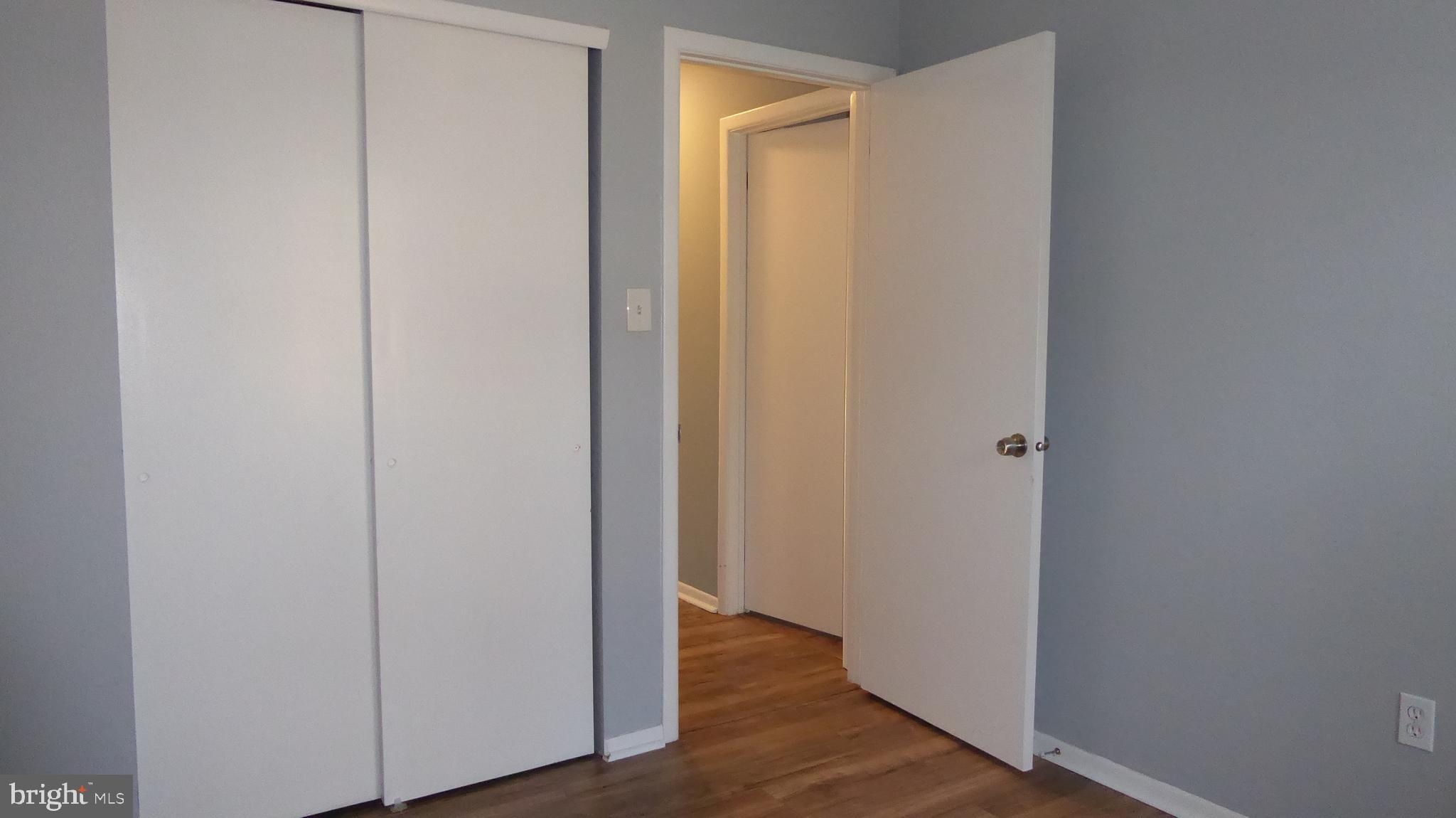 4 Hamilton Court Berlin, NJ 08009 - Photo 27 of 46 a view of a hallway with wooden floor