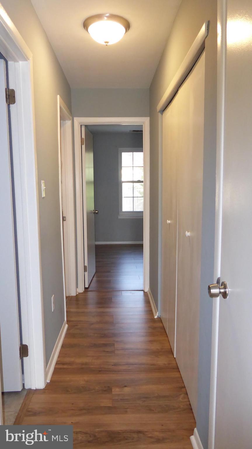 4 Hamilton Court Berlin, NJ 08009 - Photo 28 of 46 a view of a hallway with wooden floor