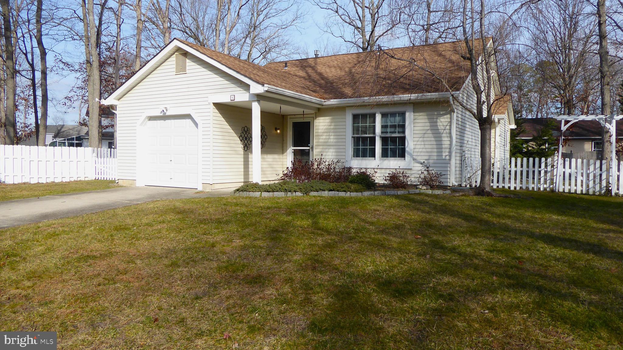 4 Hamilton Court Berlin, NJ 08009 - Photo 4 of 46 a front view of house with yard and green space