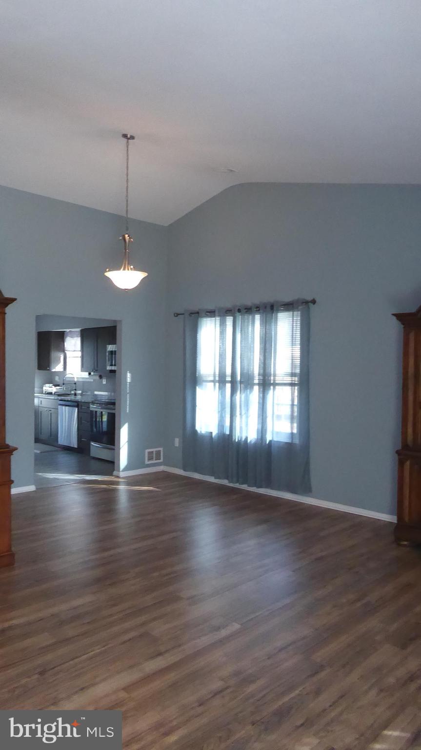 4 Hamilton Court Berlin, NJ 08009 - Photo 10 of 46 a view of empty room with wooden floor and window