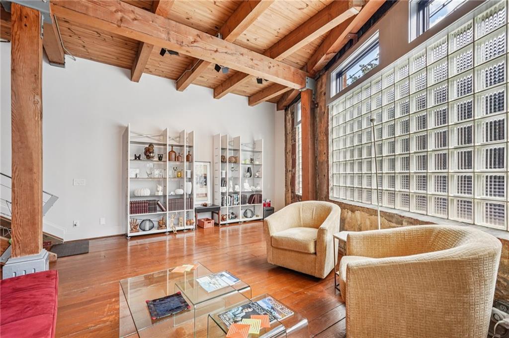 205 Walker Street Southwest, Unit G8 Atlanta, GA 30313 - Photo 12 of 41 a living room with furniture and floor to ceiling window