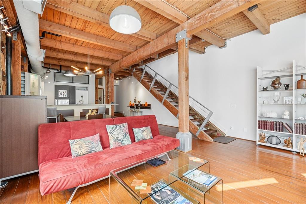 205 Walker Street Southwest, Unit G8 Atlanta, GA 30313 - Photo 13 of 41 a living room with furniture and a book shelf