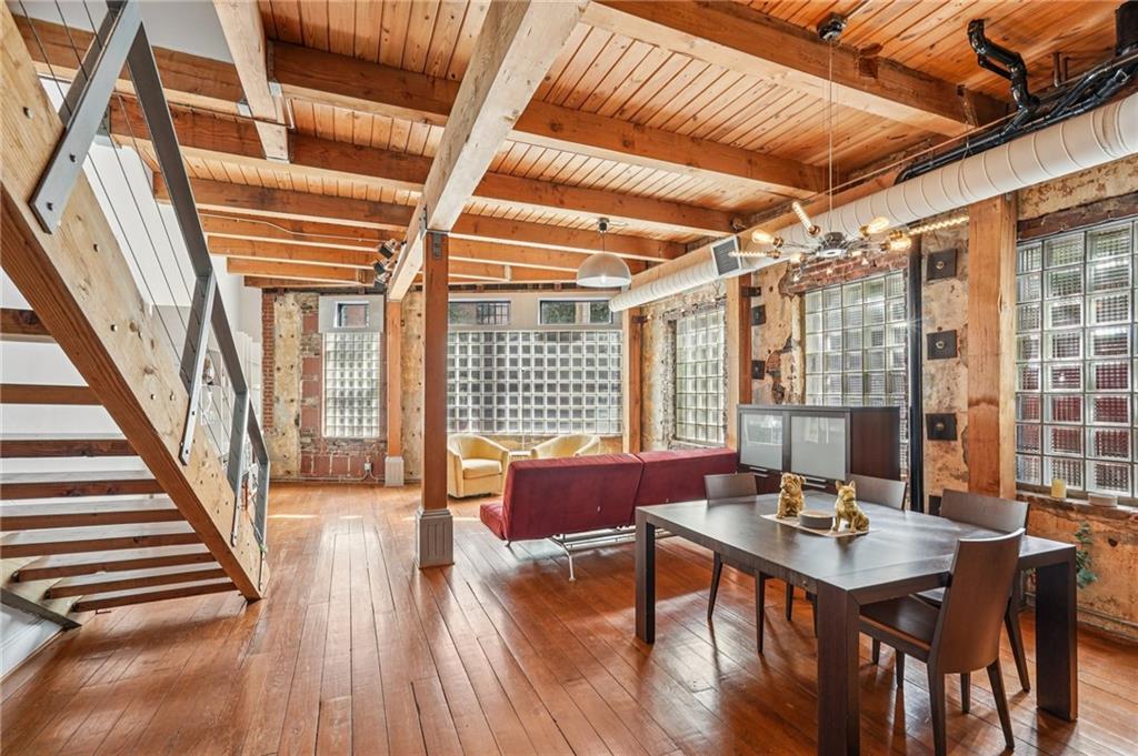 205 Walker Street Southwest, Unit G8 Atlanta, GA 30313 - Photo 15 of 41 a view of a dining room with furniture window and wooden floor