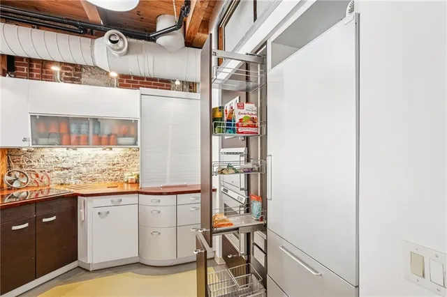 a kitchen with a sink and cabinets