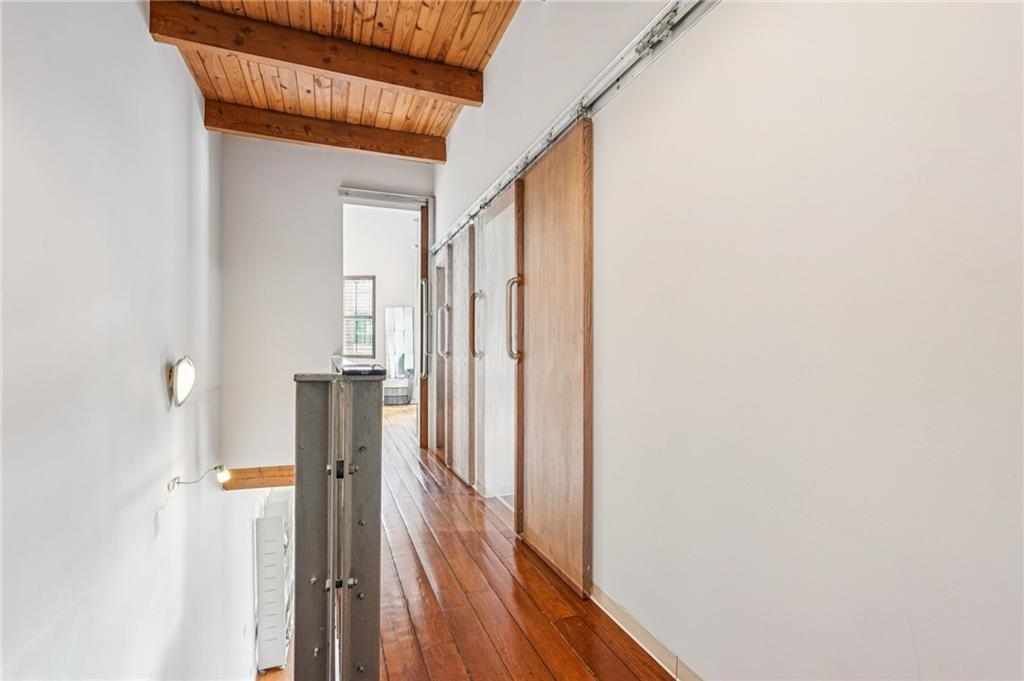 205 Walker Street Southwest, Unit G8 Atlanta, GA 30313 - Photo 23 of 41 a view of a hallway with wooden floor