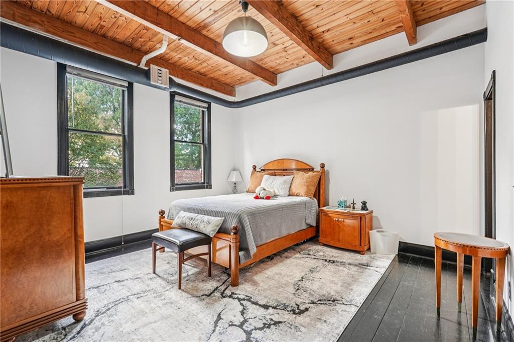 205 Walker Street Southwest, Unit G8 Atlanta, GA 30313 - Photo 32 of 41 a bedroom with furniture and a window