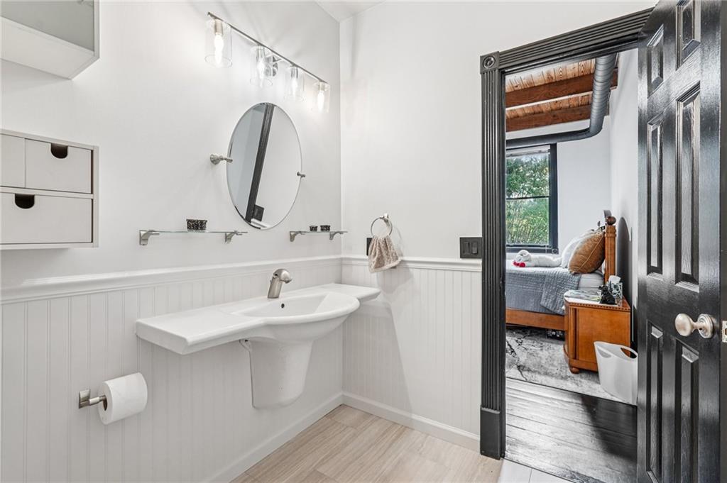205 Walker Street Southwest, Unit G8 Atlanta, GA 30313 - Photo 34 of 41 a bathroom with a sink and a mirror