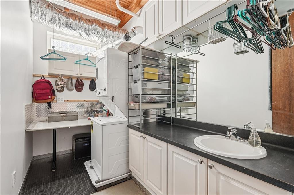 205 Walker Street Southwest, Unit G8 Atlanta, GA 30313 - Photo 35 of 41 a bathroom with a sink double vanity and a mirror
