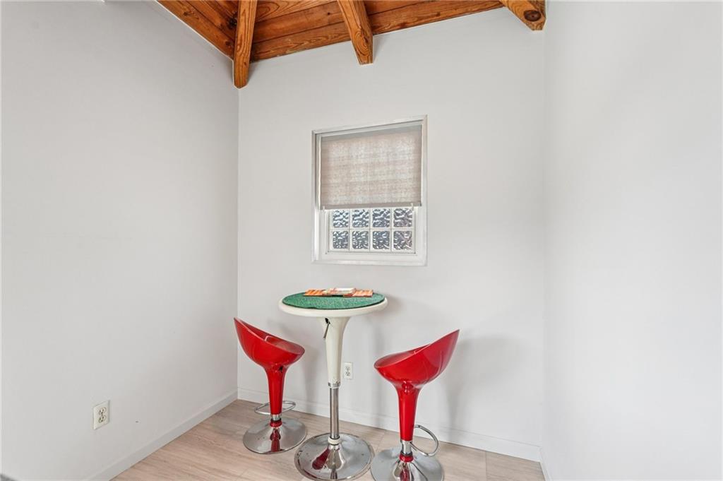 205 Walker Street Southwest, Unit G8 Atlanta, GA 30313 - Photo 36 of 41 a view of a room with shelves and wooden floor