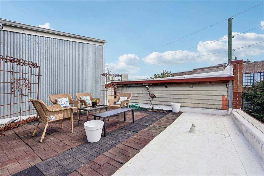205 Walker Street Southwest, Unit G8 Atlanta, GA 30313 - Photo 38 of 41 a view of a terrace with furniture and stove
