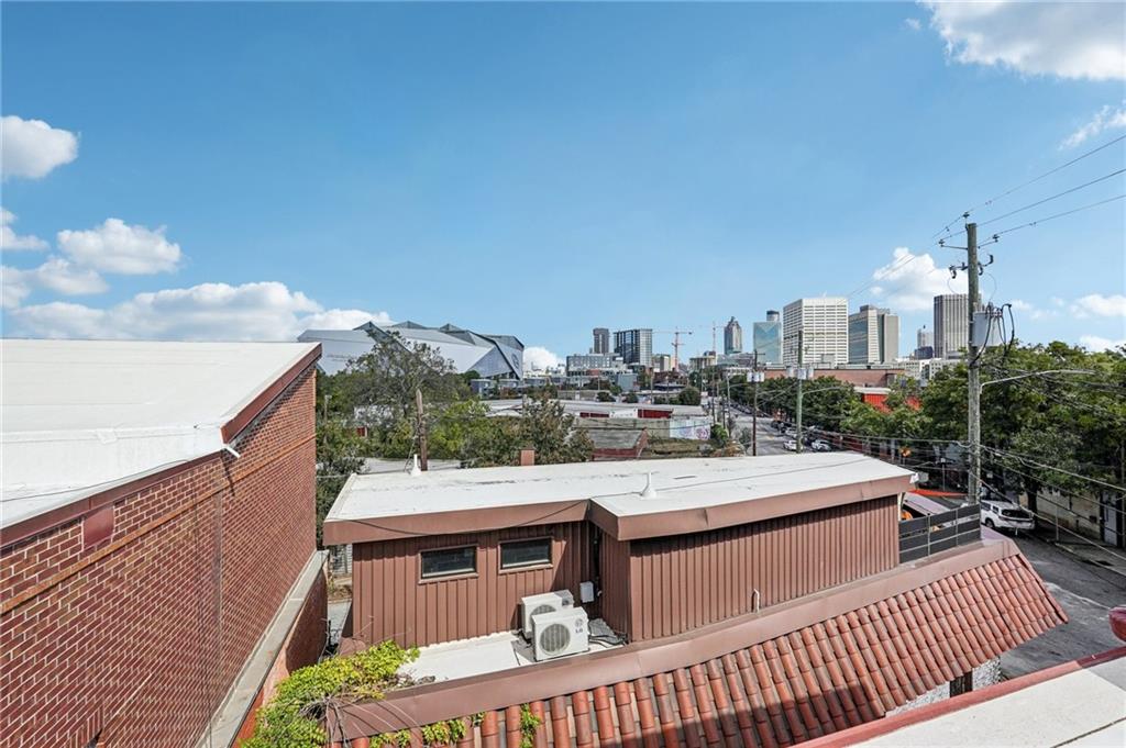 205 Walker Street Southwest, Unit G8 Atlanta, GA 30313 - Photo 40 of 41 a view of a balcony with city view