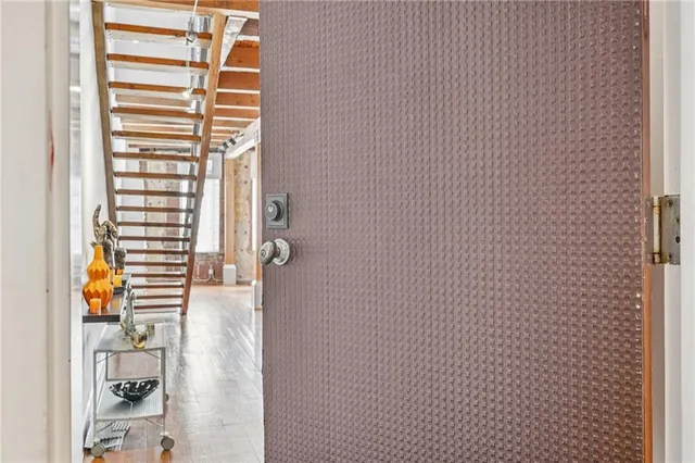 a view of an entryway with wooden floor