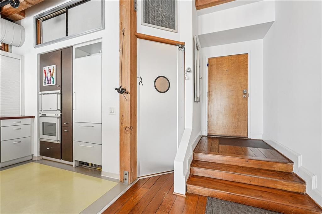 205 Walker Street Southwest, Unit G8 Atlanta, GA 30313 - Photo 10 of 41 a view of an entryway with wooden floor