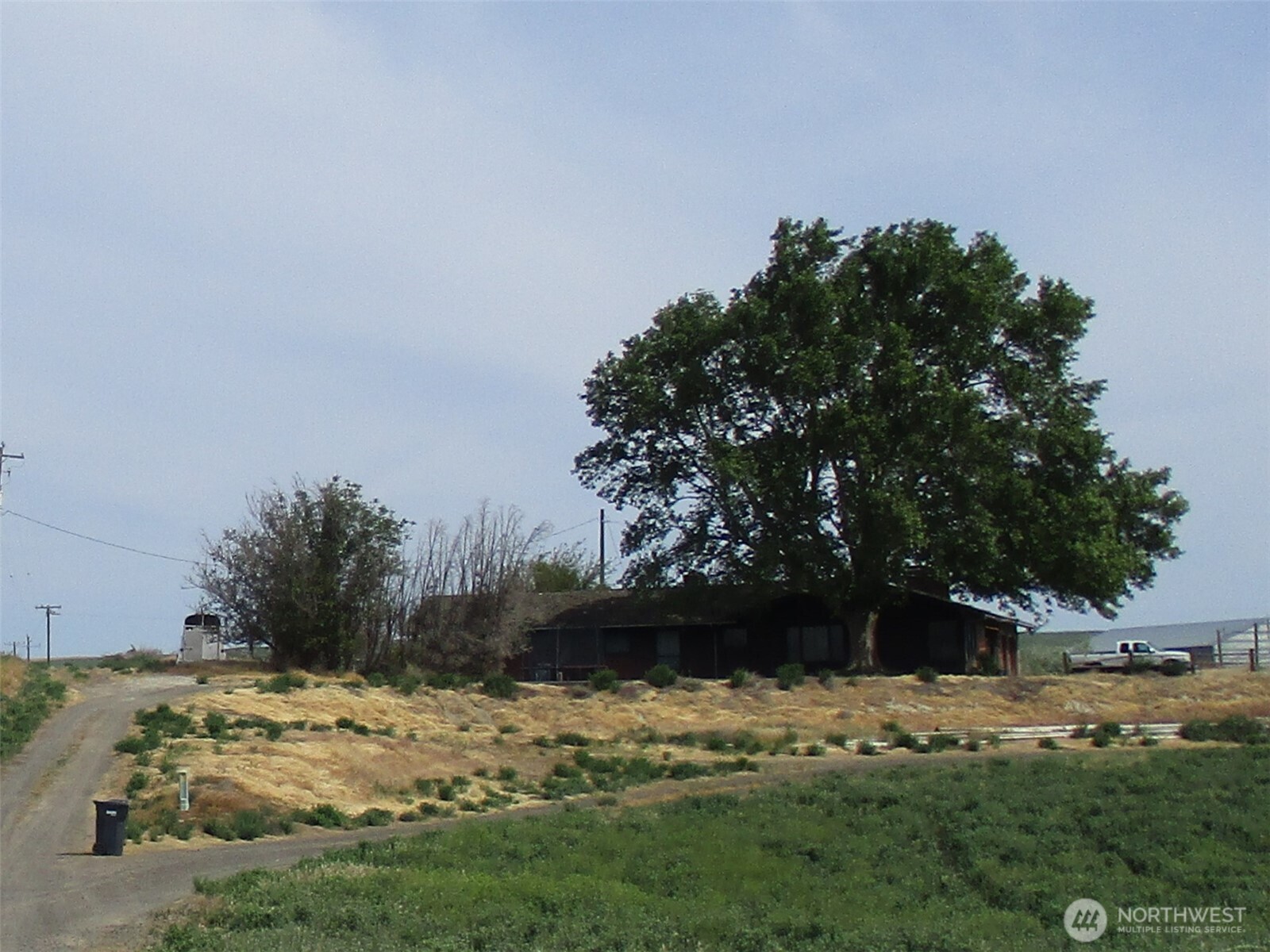 669 Cummins Road Touchet, WA 99360 - Photo 11 of 13 a view of a dirt road with a building in the background
