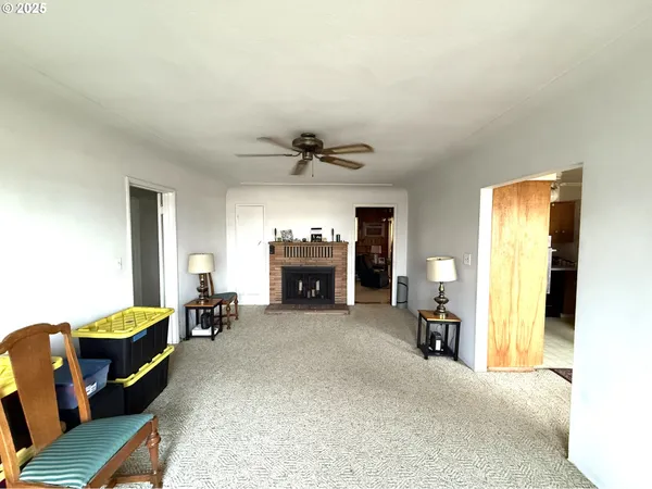 a kitchen with granite countertop a refrigerator stove top oven and sink