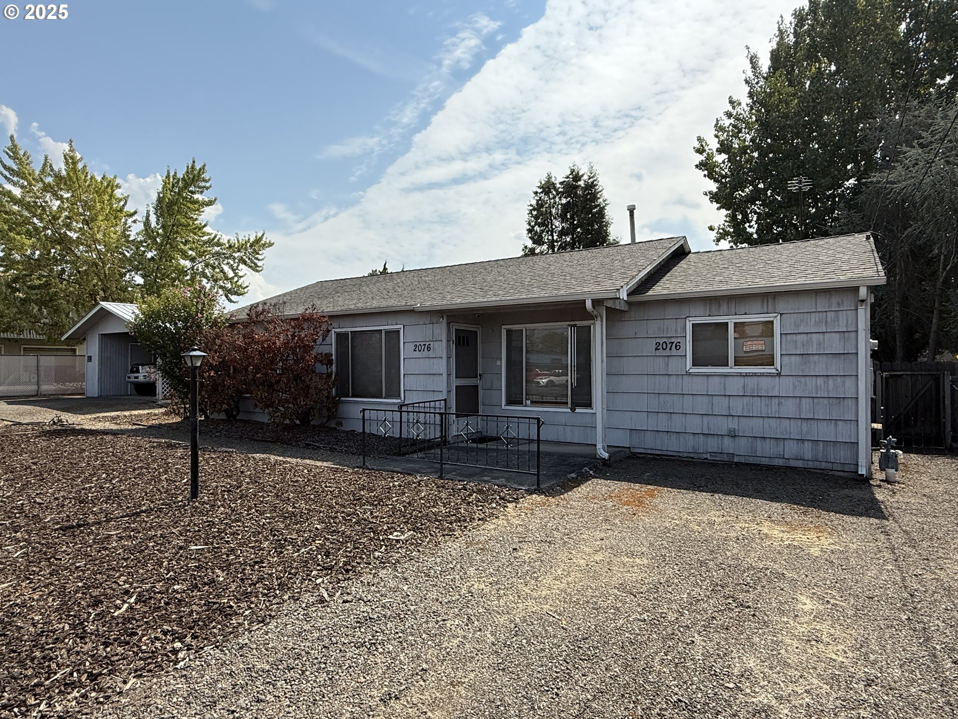 2076 Roberts Road Medford, OR 97504 - Photo 10 of 29 a view of a house with a yard and tree