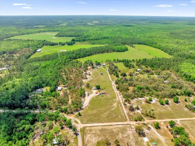 a view of a lake with a big yard