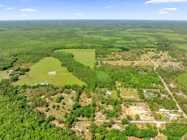 a view of a field with an ocean