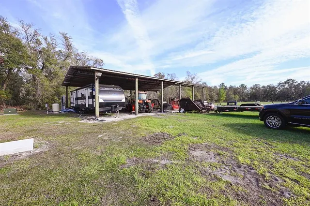 a view of a garage with a bike and car