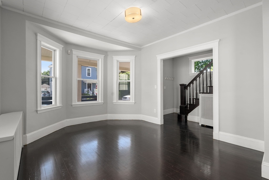 460 Beech Street Boston, MA 02131 - Photo 11 of 25 a view of an entryway with wooden floor and a window