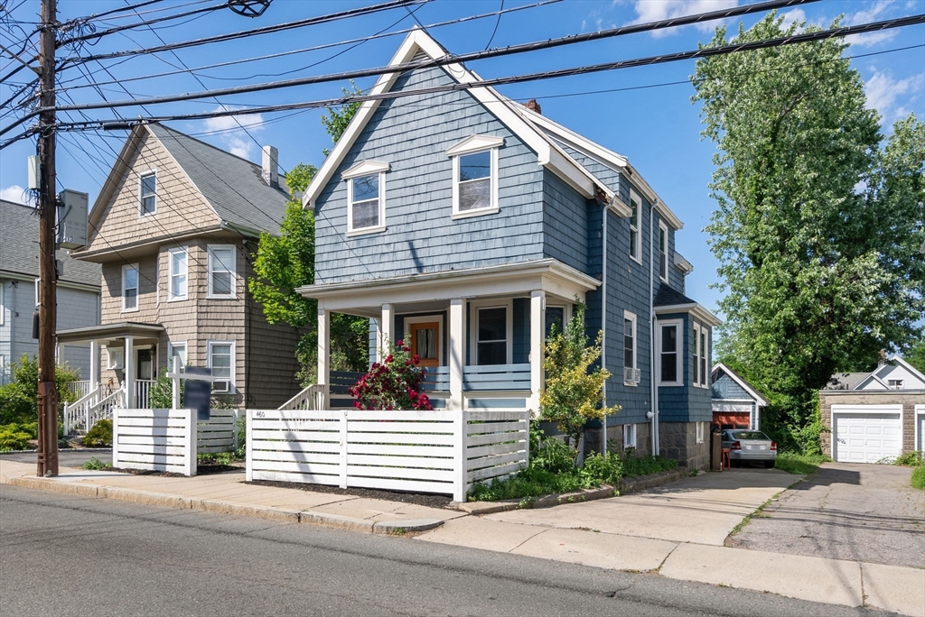 460 Beech Street Boston, MA 02131 - Photo 2 of 25 a view of a house with a small garden