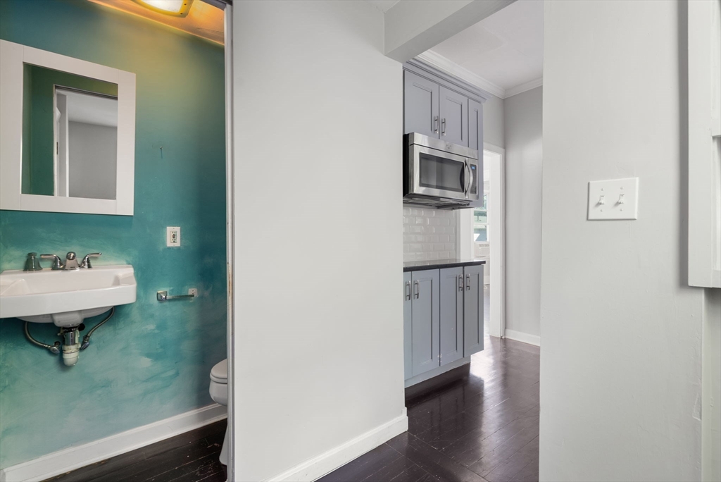 460 Beech Street Boston, MA 02131 - Photo 24 of 25 a bathroom with a sink a toilet and shower