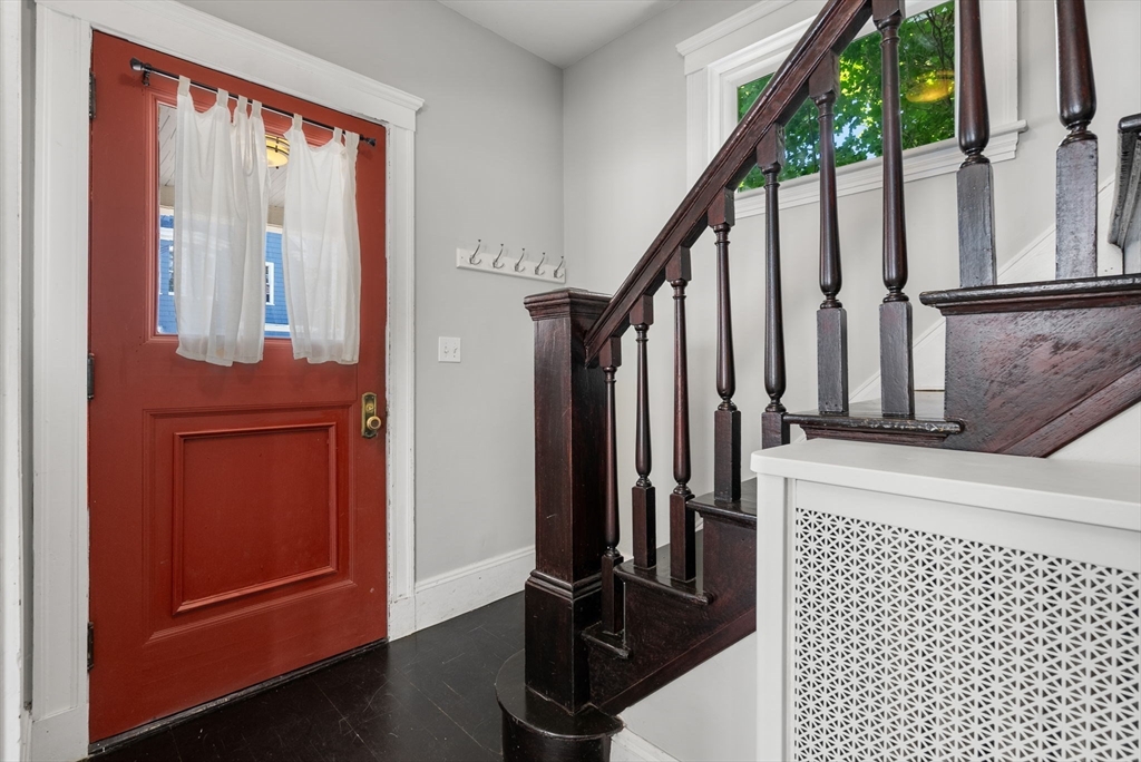 460 Beech Street Boston, MA 02131 - Photo 3 of 25 a view of front door with wooden floor