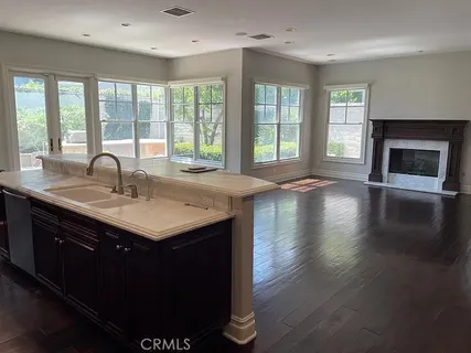 a kitchen with a sink and a large window
