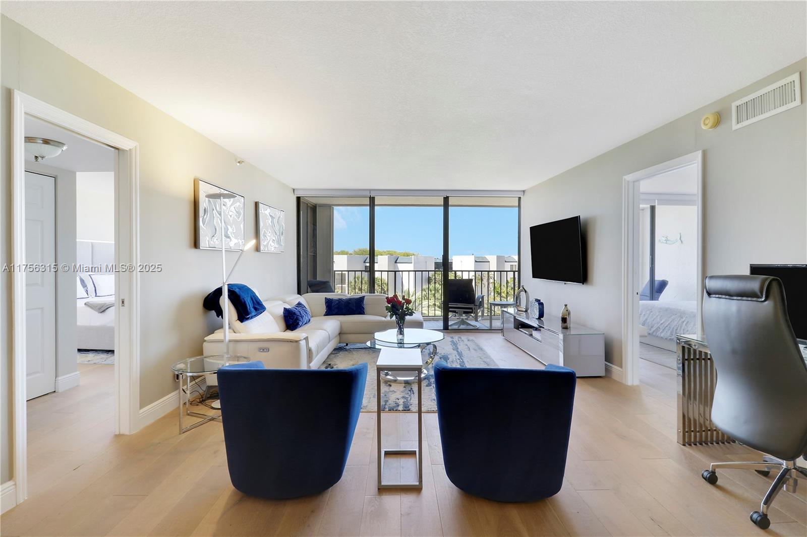 1300 Florida A1A, Unit 325 Jupiter, FL 33477 - Photo 14 of 44 a view of a dining room with furniture and a flat screen tv