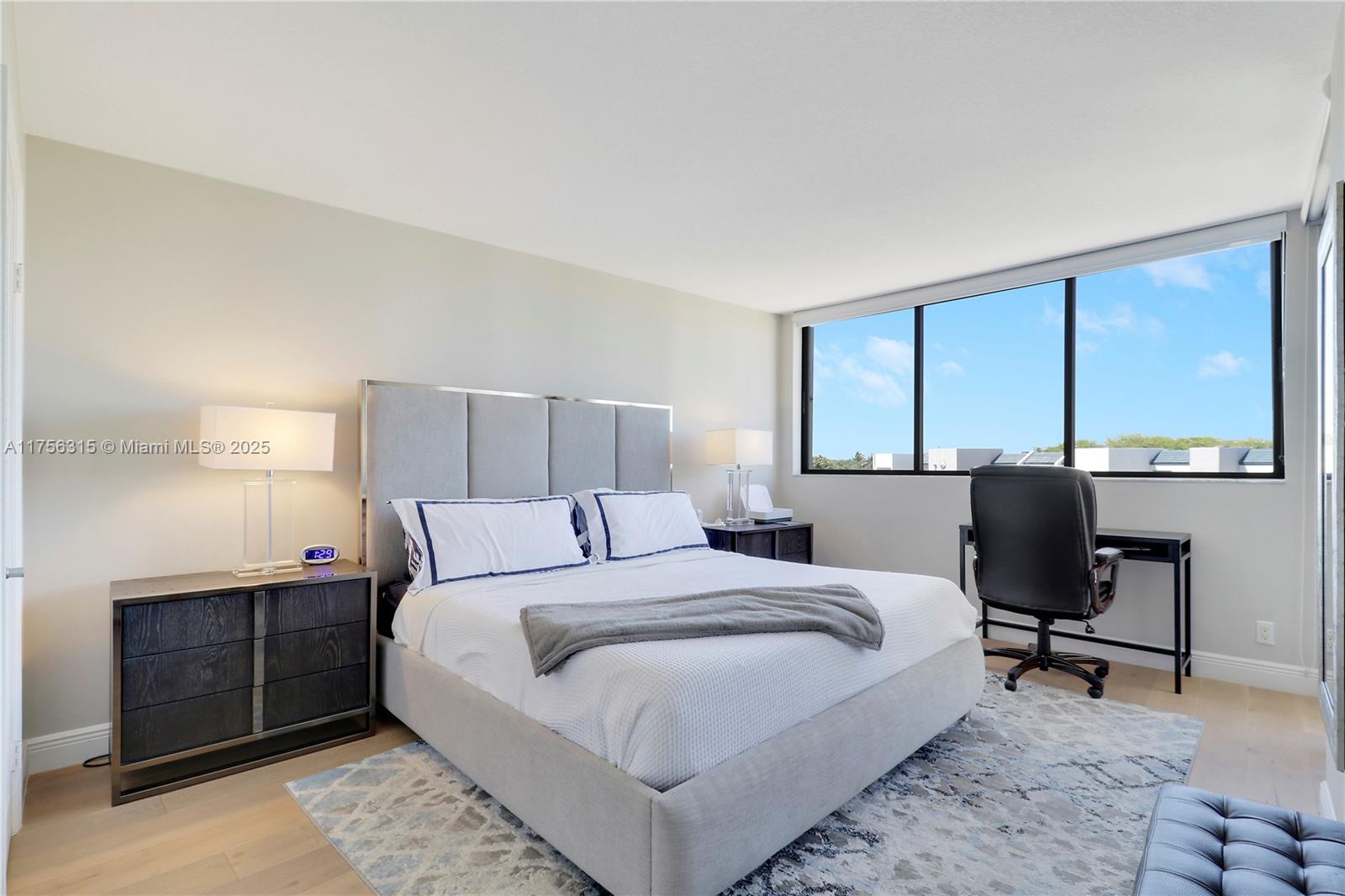 1300 Florida A1A, Unit 325 Jupiter, FL 33477 - Photo 16 of 44 a bedroom with a large bed and large windows