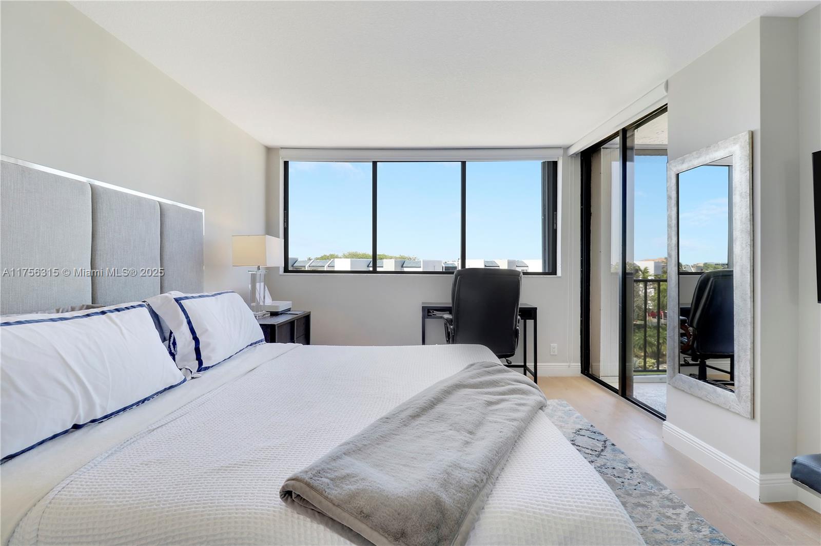 1300 Florida A1A, Unit 325 Jupiter, FL 33477 - Photo 17 of 44 a bedroom with a large bed and a large window