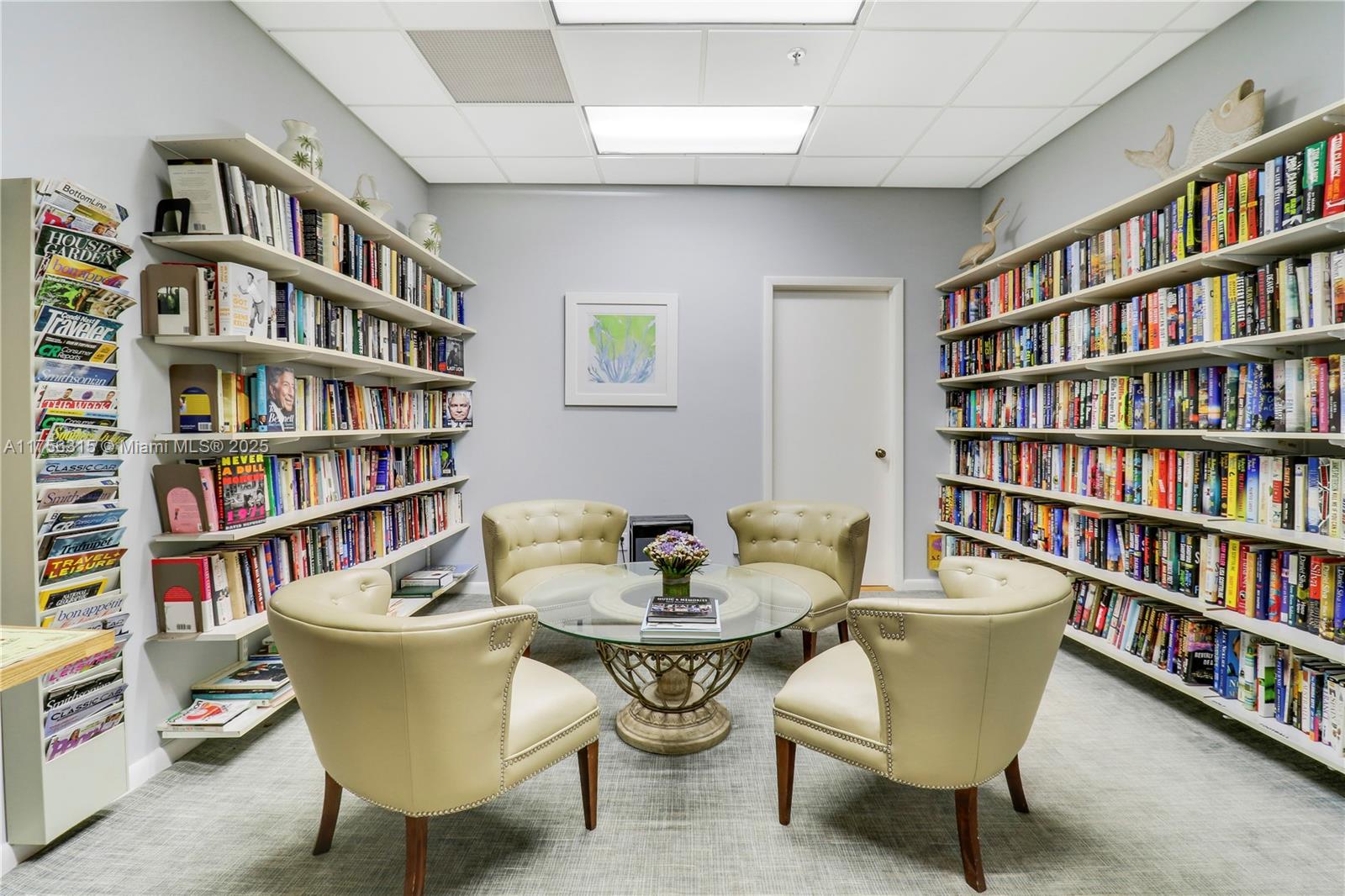 1300 Florida A1A, Unit 325 Jupiter, FL 33477 - Photo 37 of 44 a living room with furniture and a book shelf