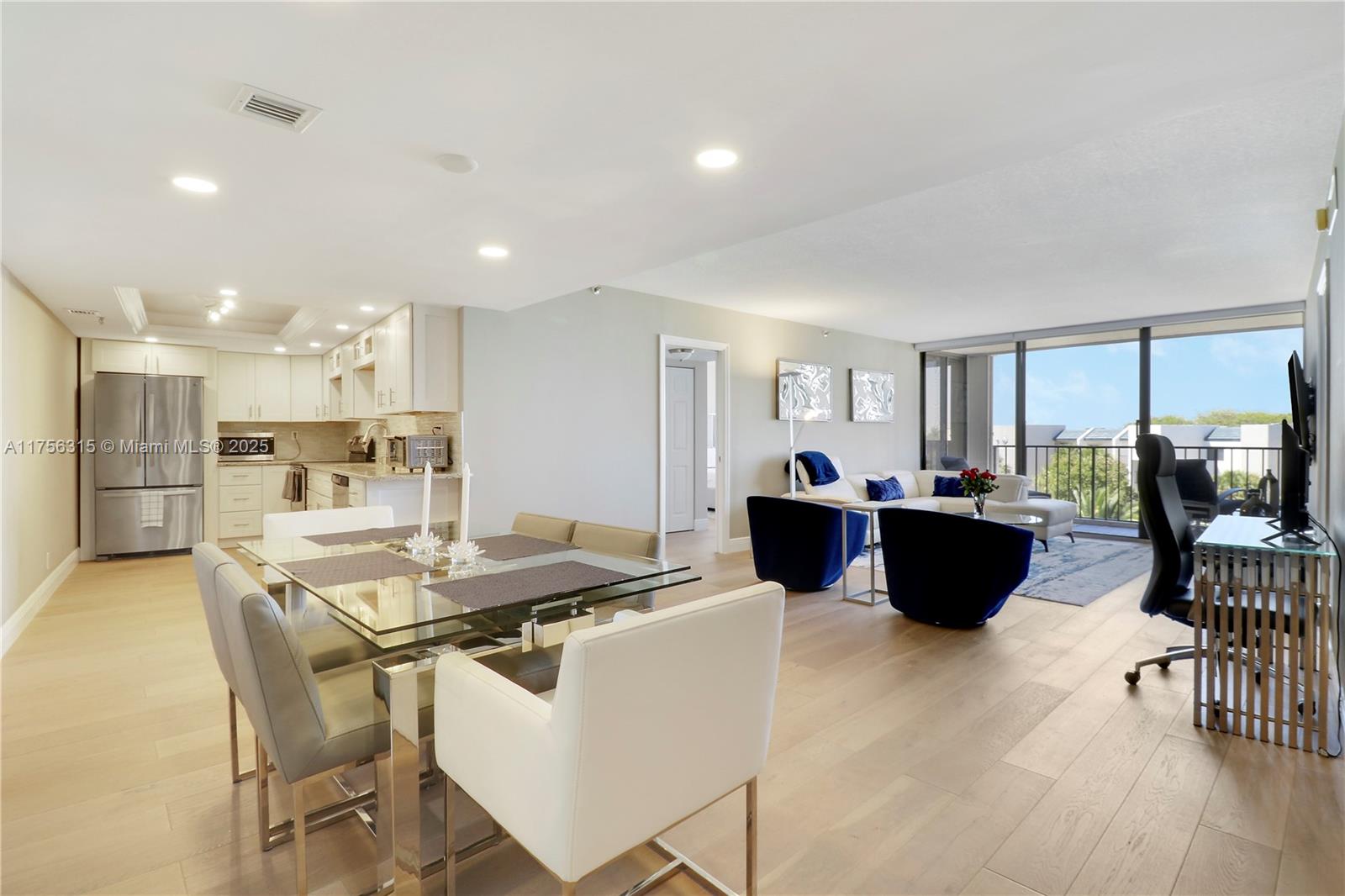 1300 Florida A1A, Unit 325 Jupiter, FL 33477 - Photo 7 of 44 a view of a dining room with furniture and a large window