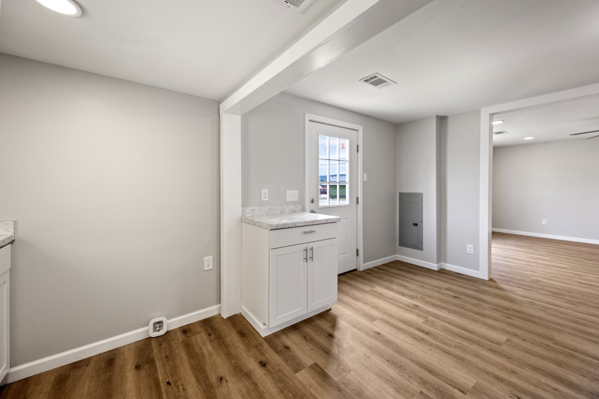 102 Hodges Street North Cowan, TN 37318 - Photo 15 of 23 a view of an empty room with window and wooden floor