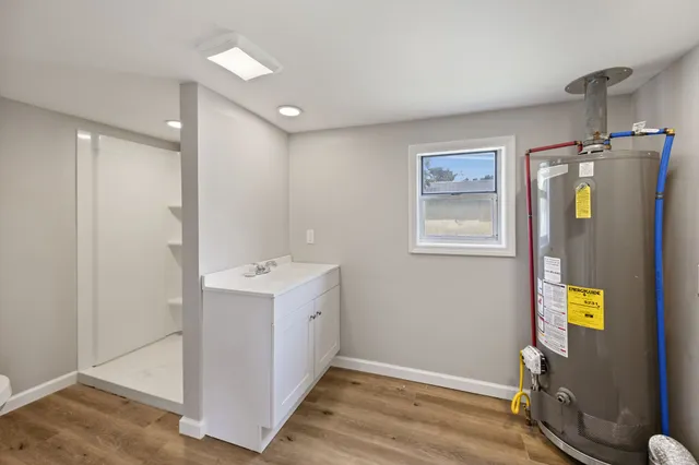 a view of an entryway with wooden floor