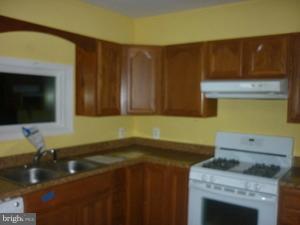 16 Kidwell Road Boston, VA 22713 - Photo 2 of 6 a kitchen with a sink cabinets and a stove top oven