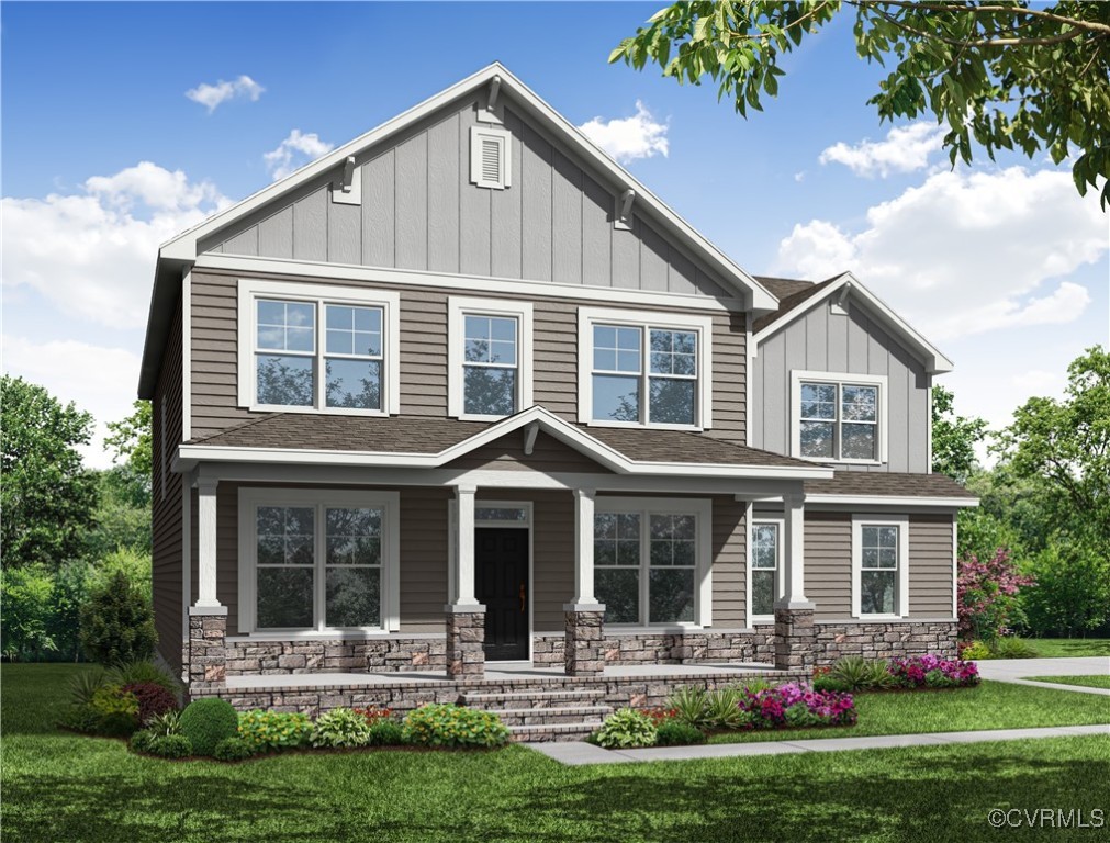 3712 Rocketts Rdg Drive Goochland, VA 23063 - Photo 1 of 1 a front view of a house with a yard table and chairs